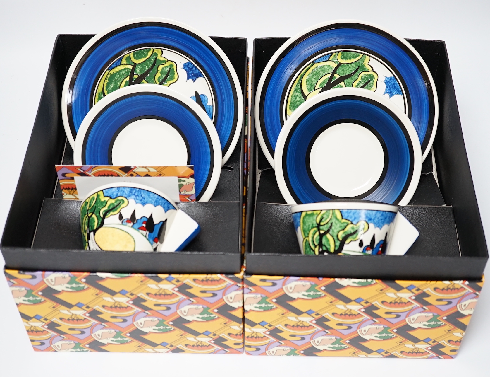 Two Wedgwood Clarice Cliff limited edition May Avenue trios, limited edition, boxed with certificates